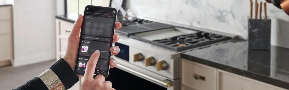 photo showing a phone displaying a smart home appliance app